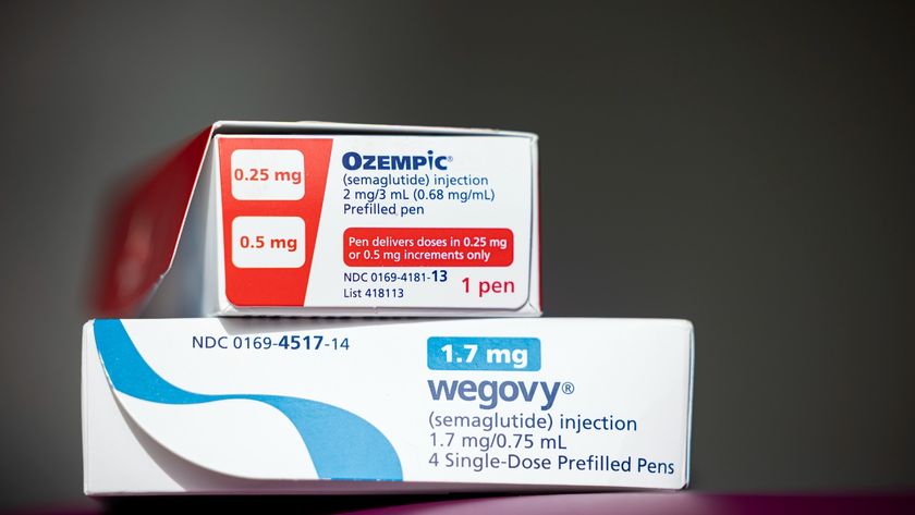 A white and red box of ozempic stacked on top of a white and blue box of wegovy 