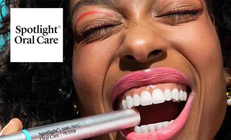spotlight oral care top left with a close up shot of a woman biting on a serum tube