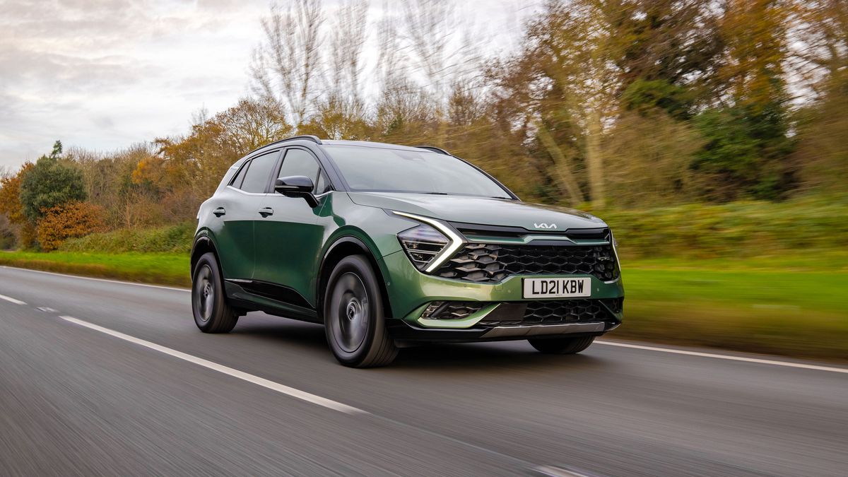 Kia Sportage driving on a road