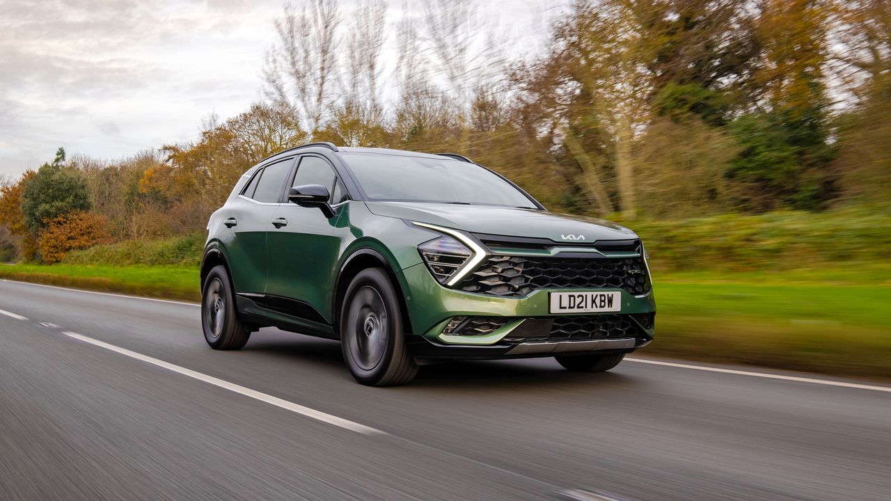 Kia Sportage driving on a road