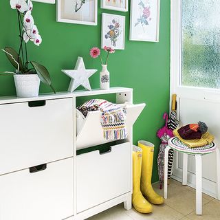 Hallway with green wall and white door