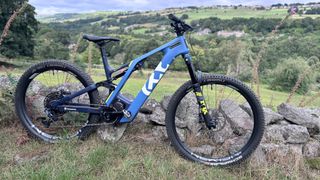 Husqvarna MC5 seen side on next to a stone wall