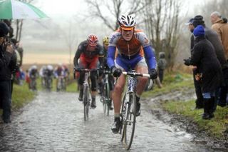 Dutchman Rick Flens (Rabobank) rides the wet cobbles.