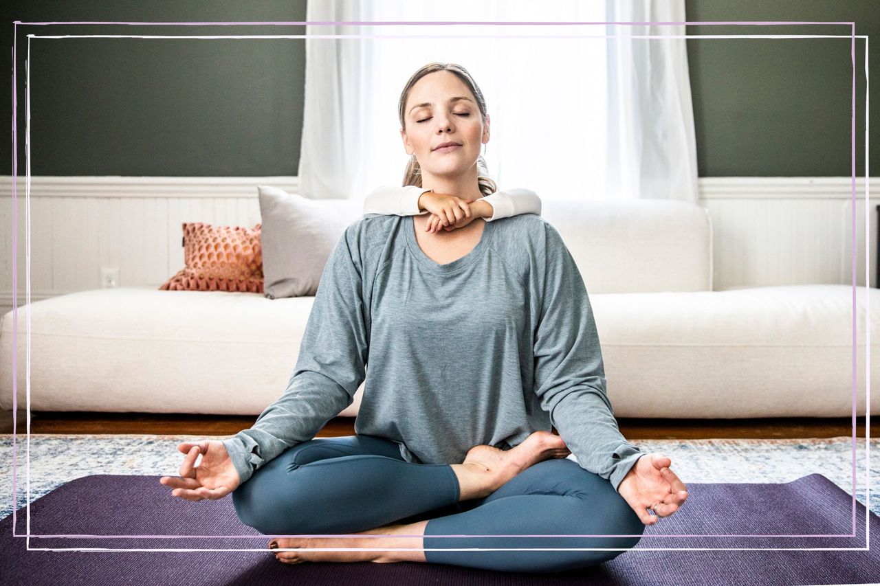 Mother and daughter doing yoga at home