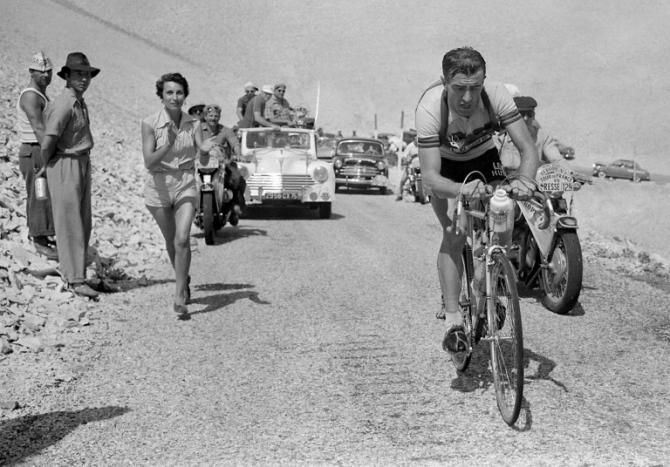 Frenchman Louison Bobet, cheered on by his wife, Christiane, climbs the Mont Ventoux in the 1955 Tour de France. Bobet went on to win his third consecutive Tour