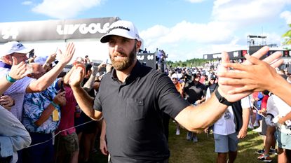 Dustin Johnson celebrates with fans after his 4 Aces GC team won the 2022 LIV Golf Team Championship in Florida
