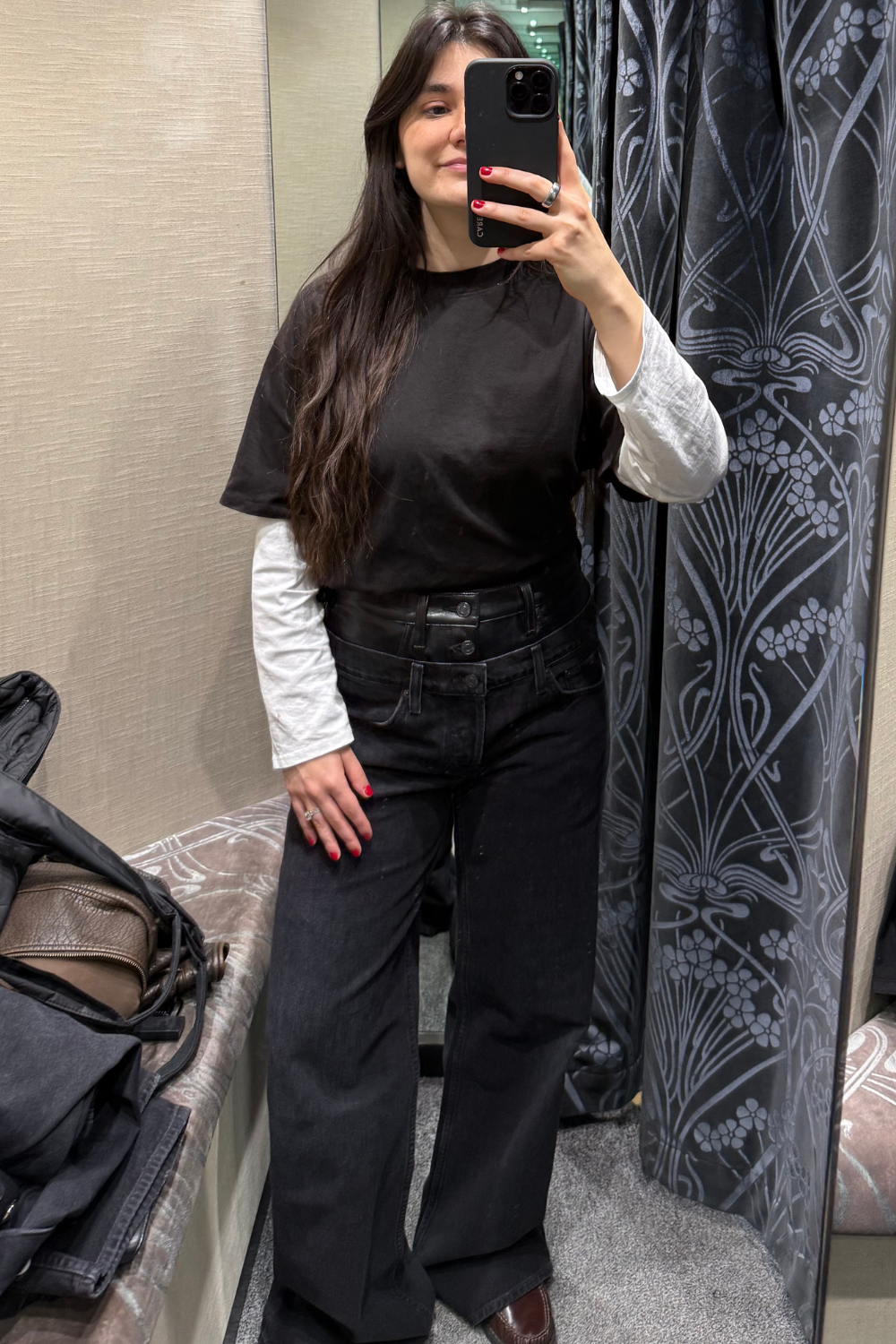 Sofia wearing black baggy jeans