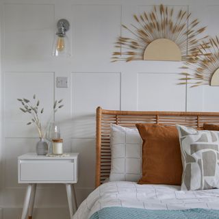 White bedroom with rattan headboard