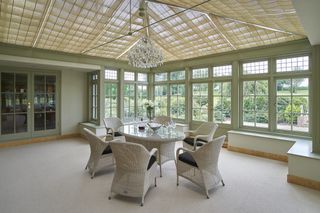 dining room in a conservatory with pendant light