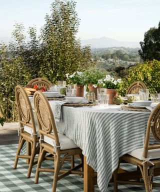 outdoor dining area on a terrace designed and styled for the mcgee and co outdoor collection 2025