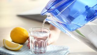 Pouring water from water filter