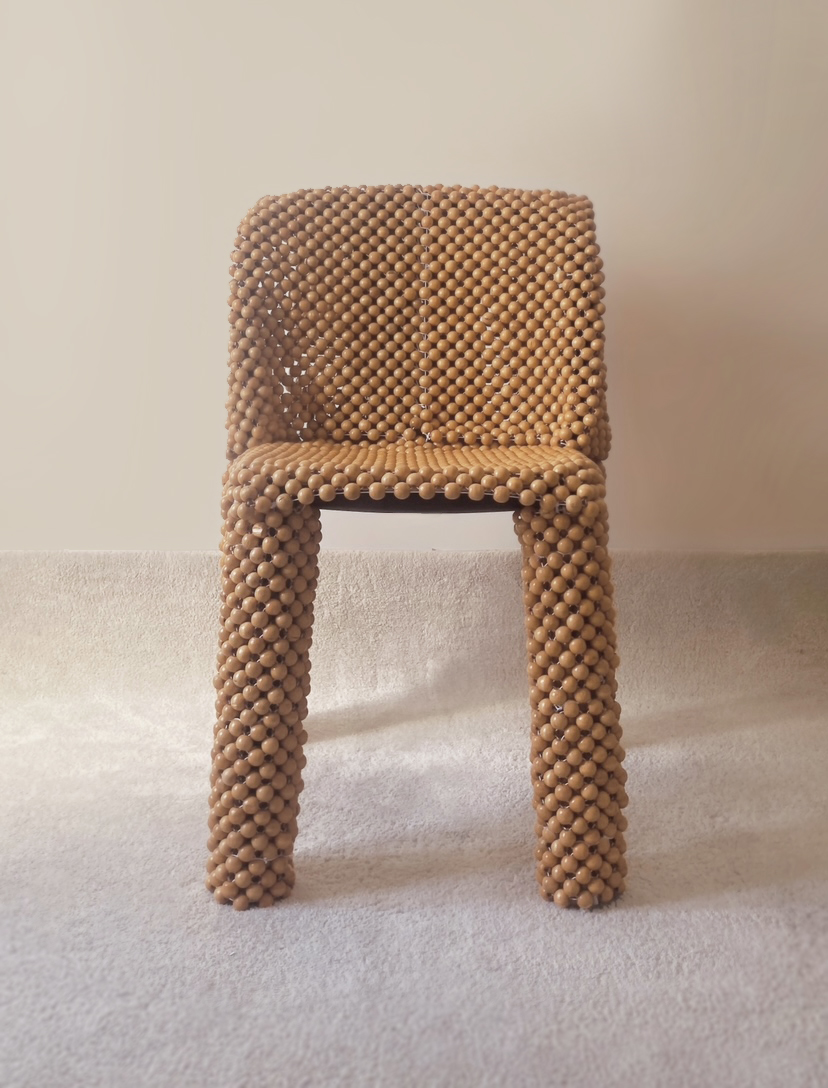 Belleville Chair covered in beads from car seats