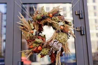 Autumn wreath hanging on an outside door.