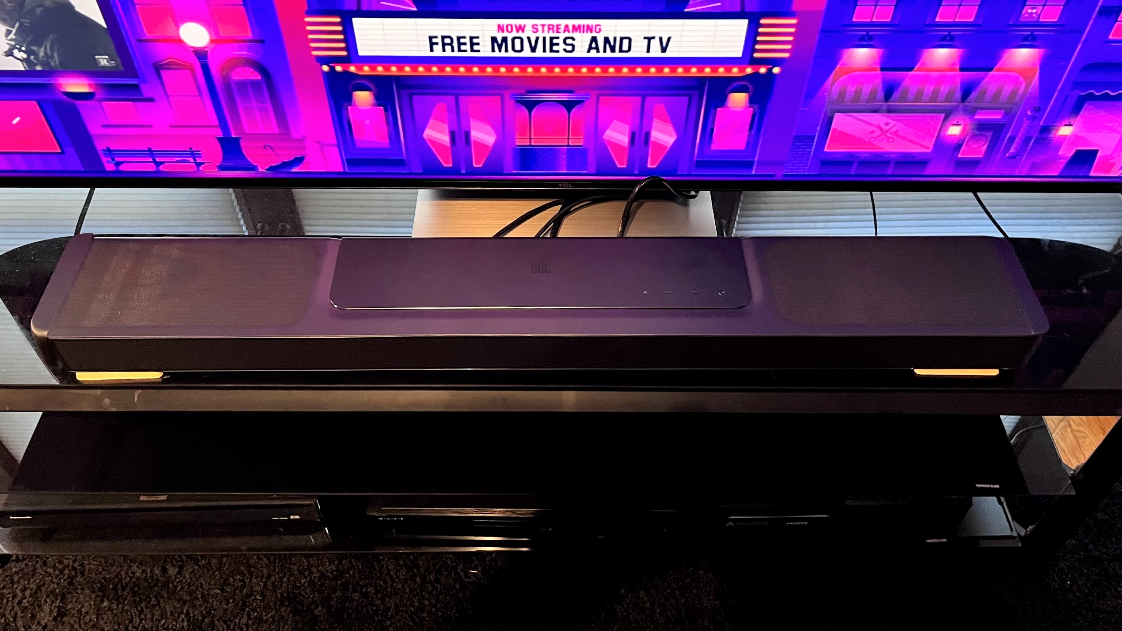 JBL Bar 1300X soundbar on TV stand