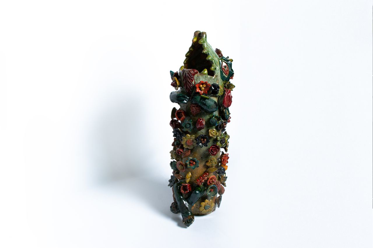 Colourful animal head ceramic vessels