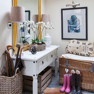 utility room with white table and cane basket