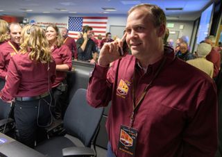 NASA Administrator Jim Bridenstine receives a congratulatory call from Vice President Mike Pence after receiving confirmation of the successful landing of the agency's InSight spacecraft on Mars on Nov. 26, 2018 at the Mission Support Area of NASA's Jet P
