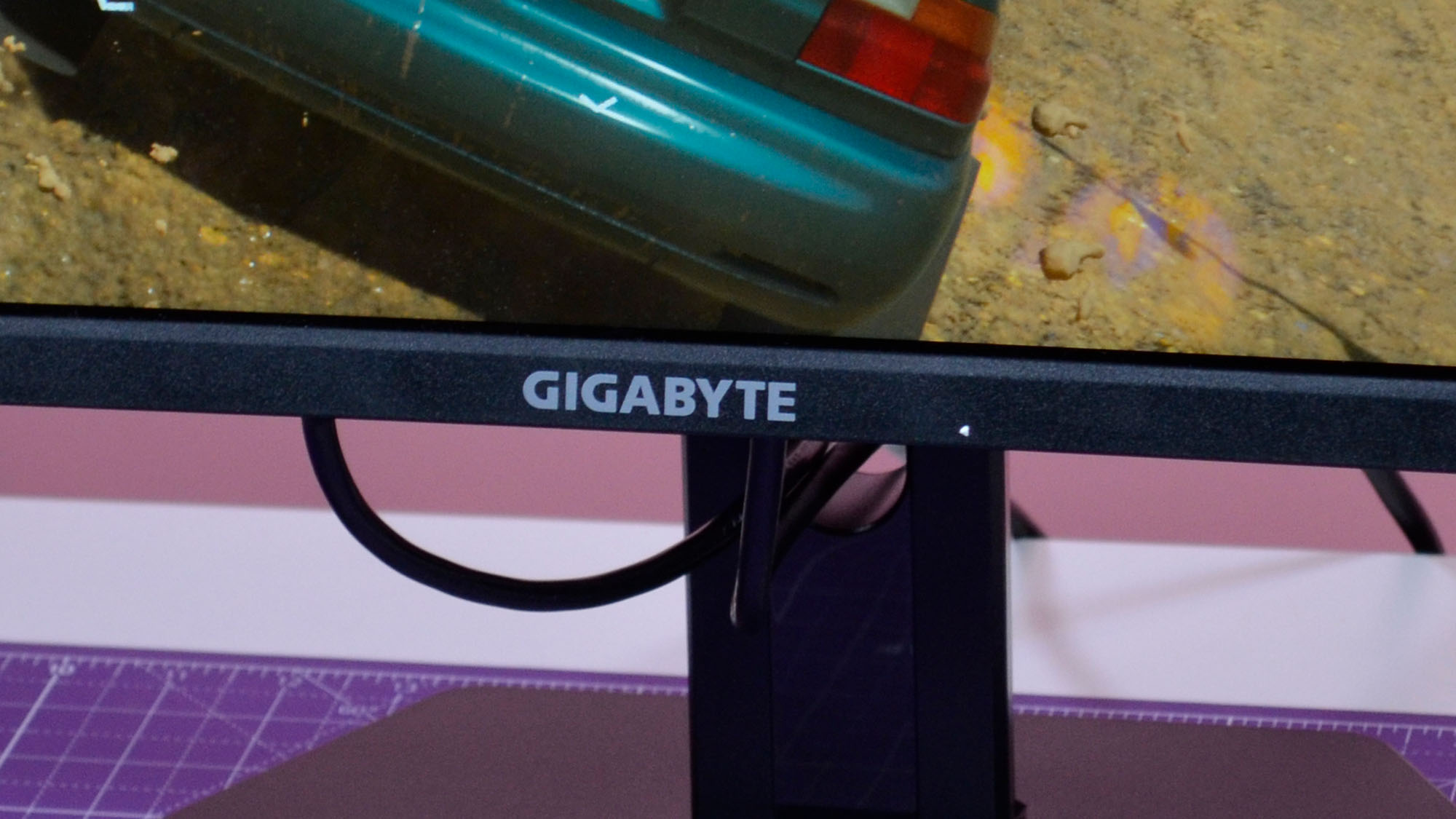 A Gigabyte GS34WQC gaming monitor on a desk