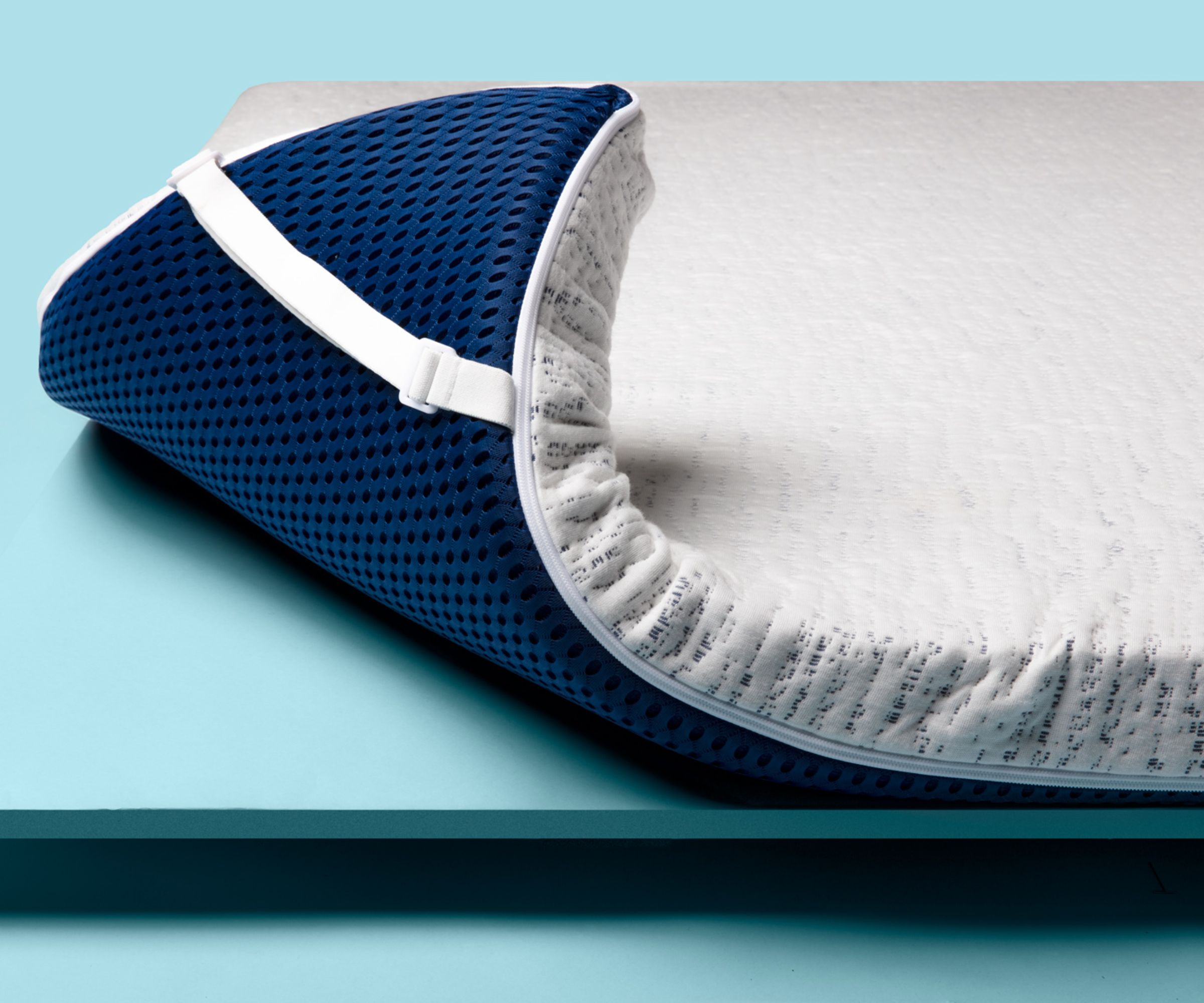 Viscosoft high density mattress topper folded at the corner showing strap