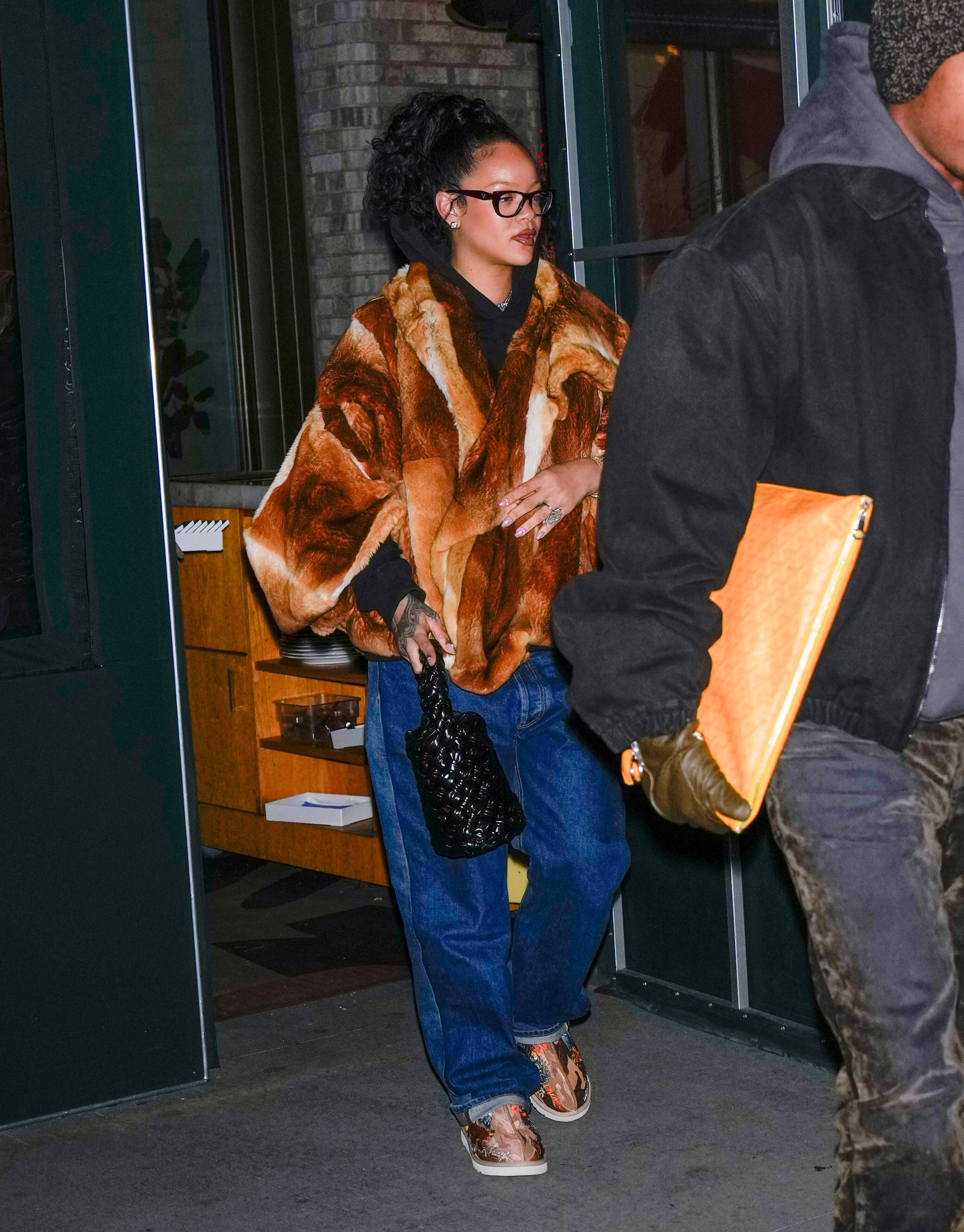 Rihanna wore Ugg slippers with a fur coat and jeans