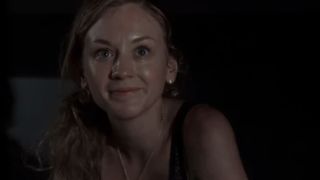 Emily Kinney with a dark background in The Walking Dead