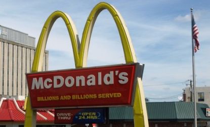 Nearly 30,000 McDonald's workers could lose their insurance if the fast-food chain has to comply with new health-care reforms.