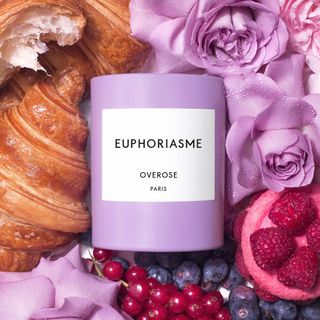 Overose Euphoriasme purple candle on food background