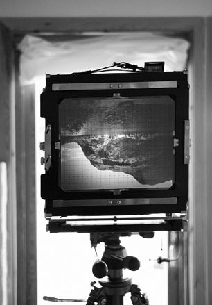 ﻿’The Ebony 8x10, Holsvatnet’ by Stuart Franklin. A screen on a tripod with an image on it.