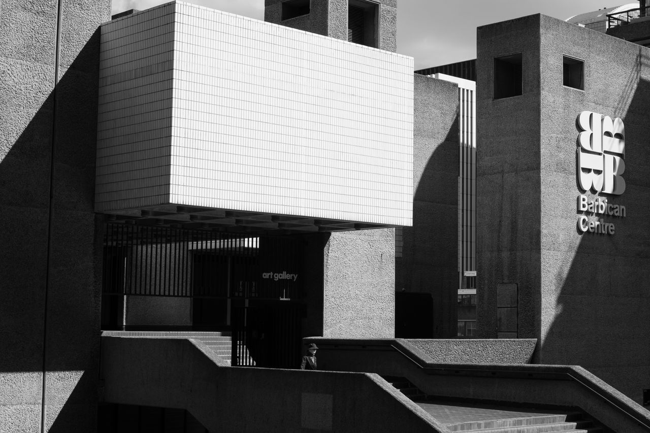 A person walking out of the Barbican Centre