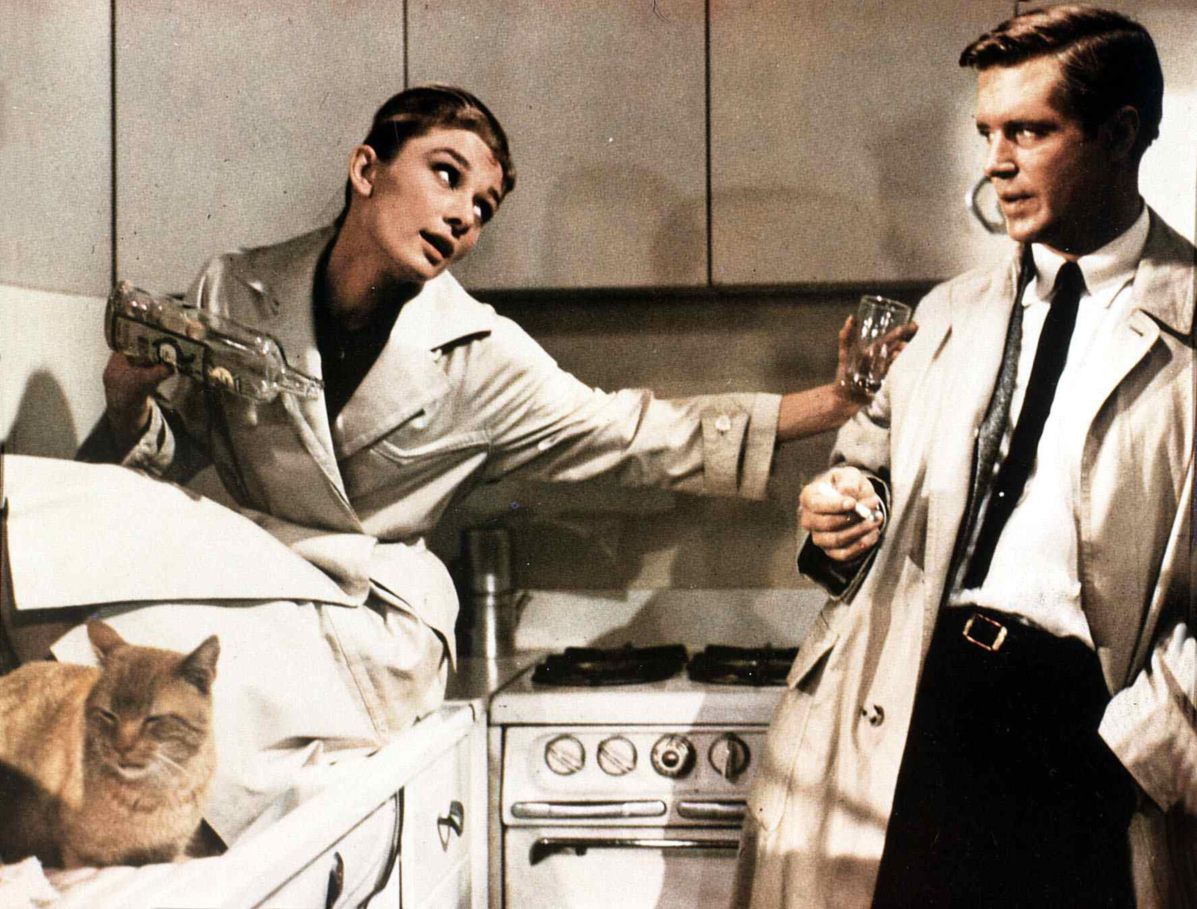 Audrey Hepburn and George Peppard in trench coats in Breakfast at Tiffany&#039;s