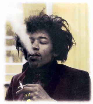 Jimi Hendrix smoking a cigarette