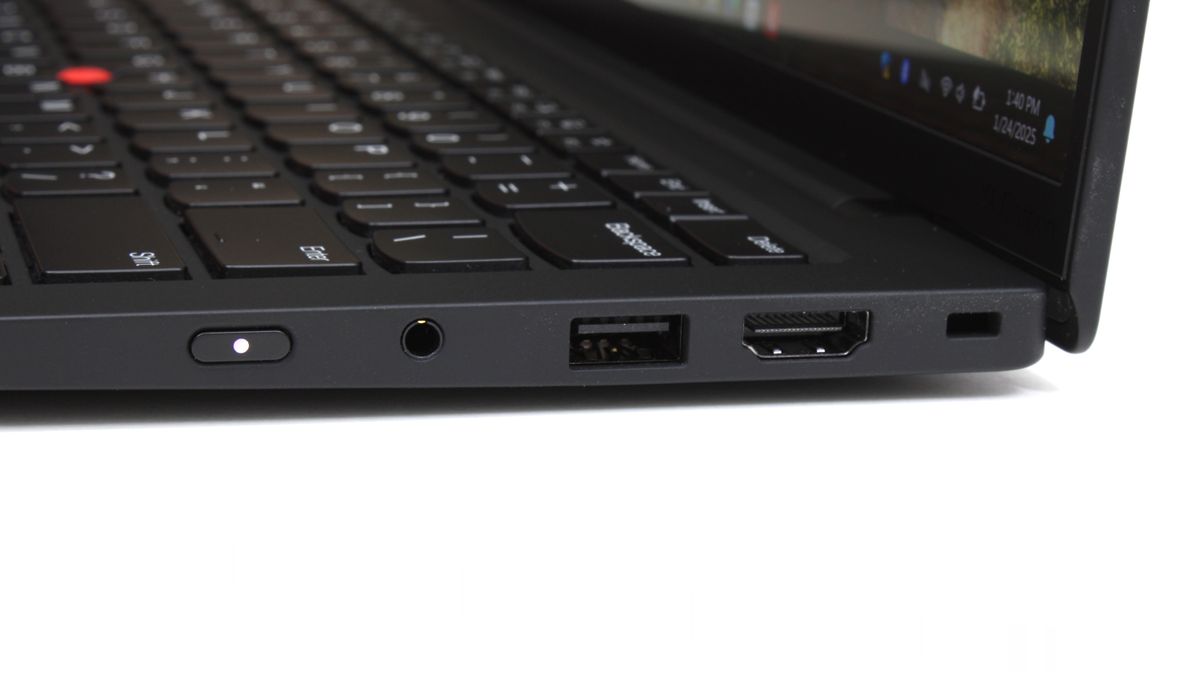 A close up of connectivity ports on the side of a laptop.