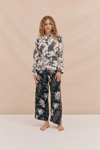 woman wearing pjama set with a contrasting floral print