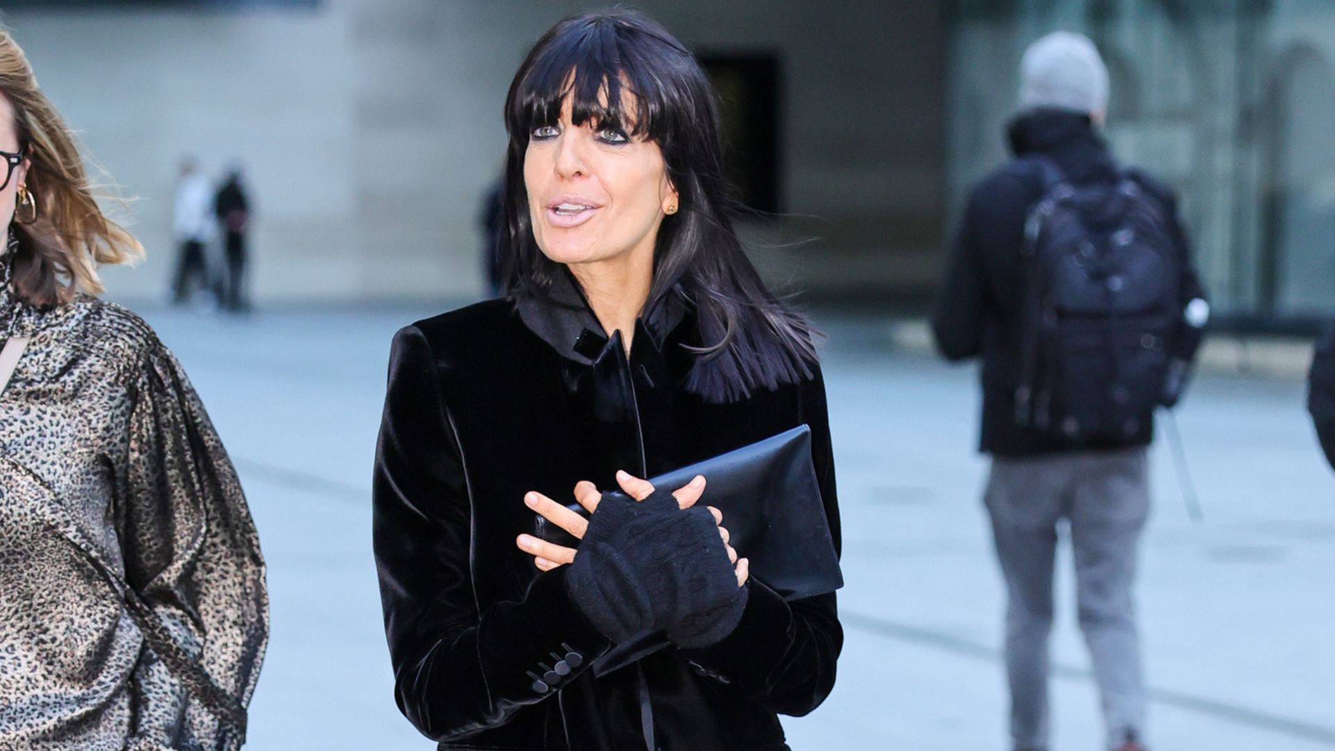 Claudia Winkleman steps out in London wearing dark grey leggings with dark brown fringed monk shoes and a velvet jacket.