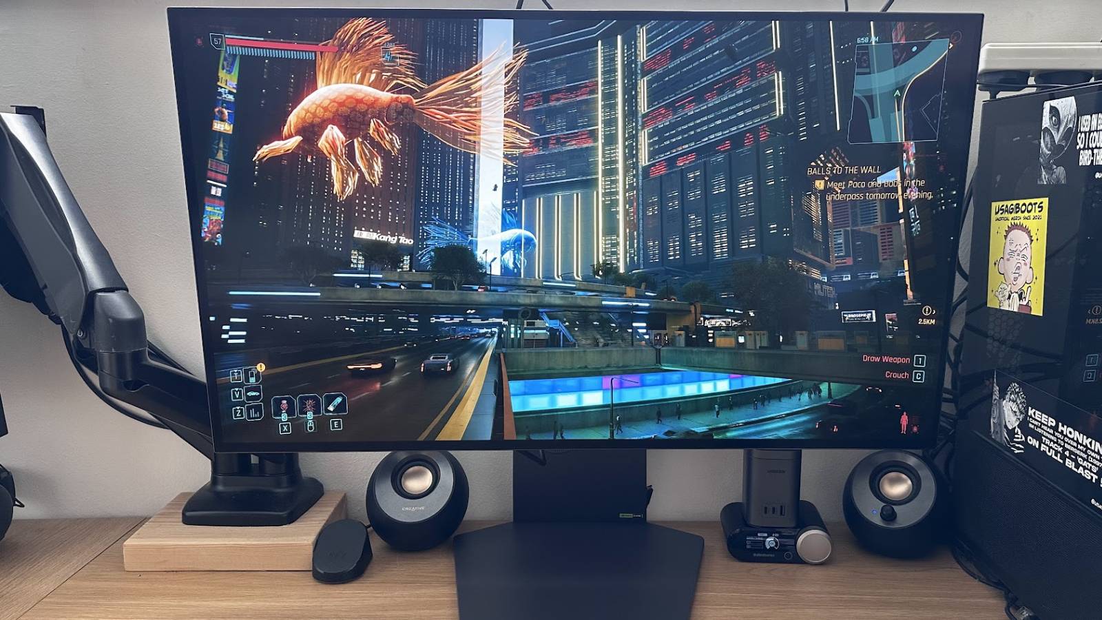 Monitor on a desk playing Cyberpunk