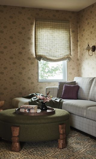 cozy living room den with wallpaper, roman blind and grey check sofa