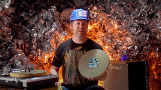 Romanus Records' owner Chris Banta with the guitar pedal/vinyl LP