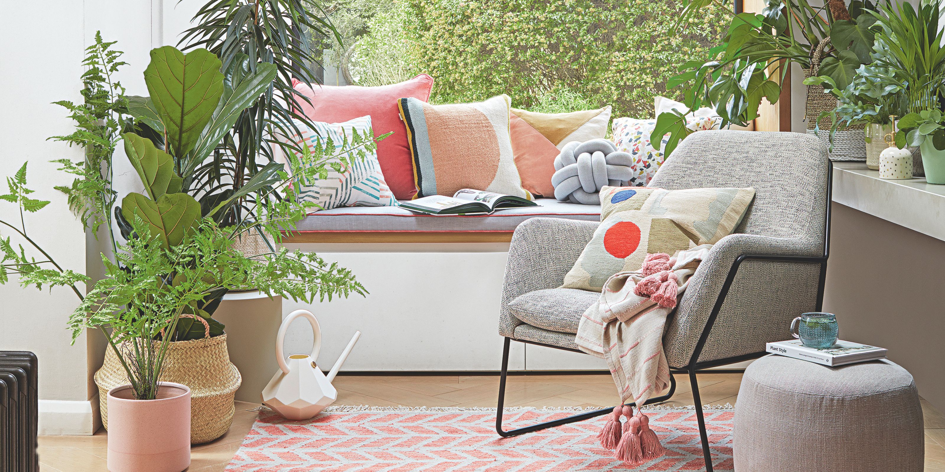 A seating corner with layered cushions and houseplants