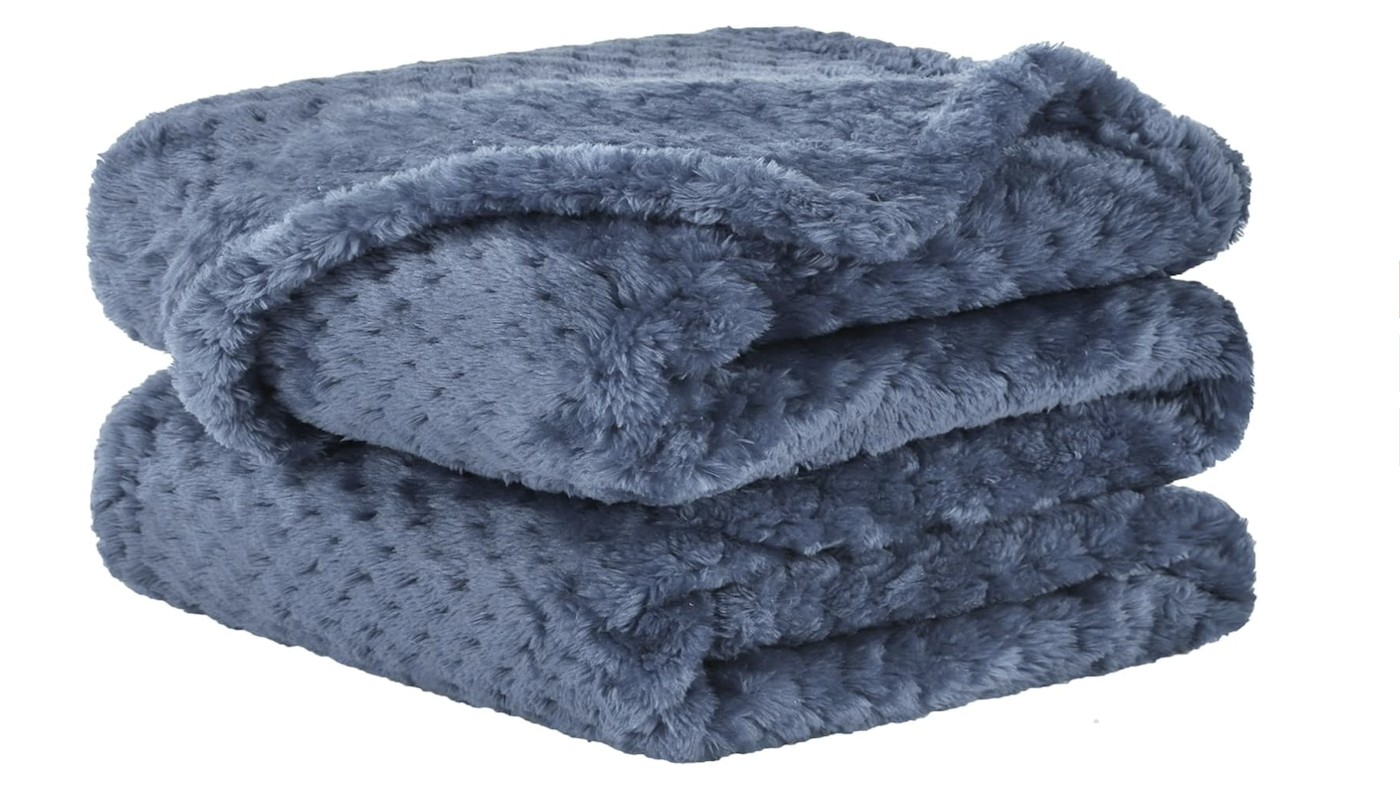 Stack of soft blue fleece blankets