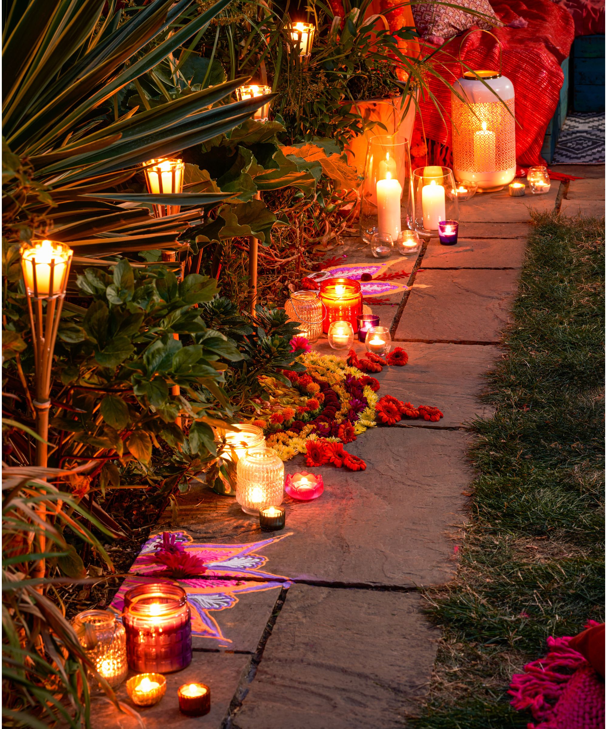 outdoor candles and lanterns on garden path