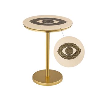 A gold nightstand with a black eye design