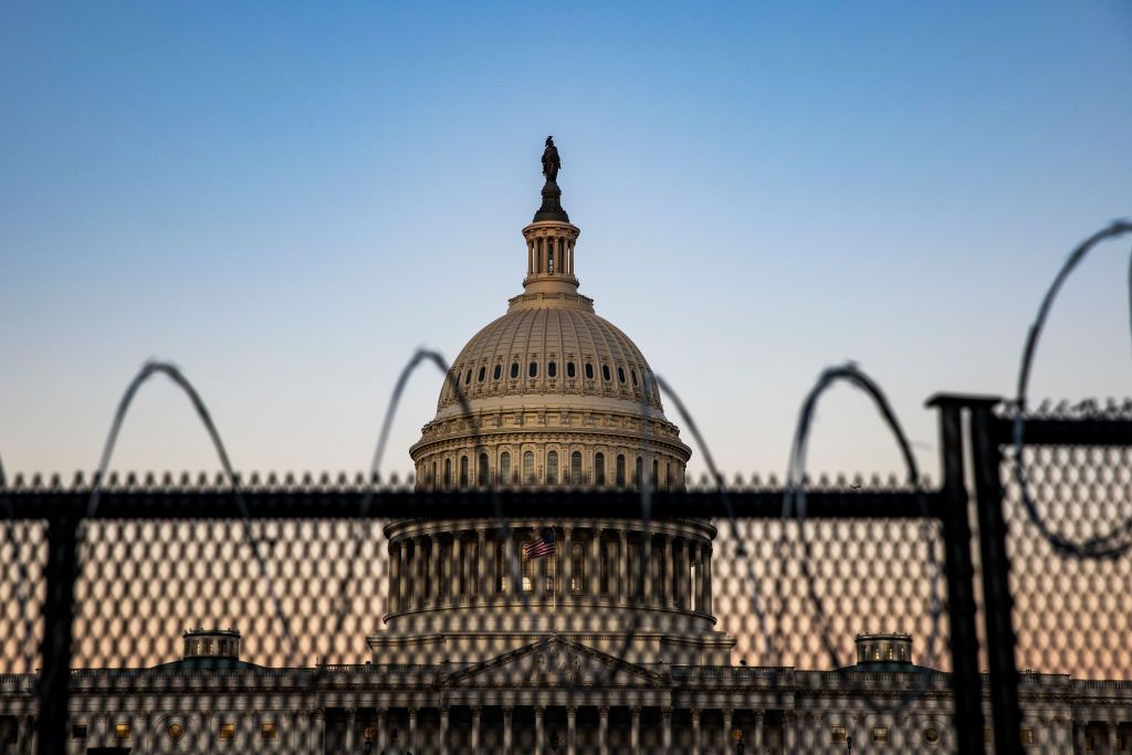 The Capitol as seen behind barbed wire.