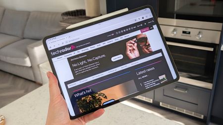 Hand holding the Oppo Pad 5 Pro