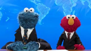 Cookie Monster and Elmo doing Weekend Update.