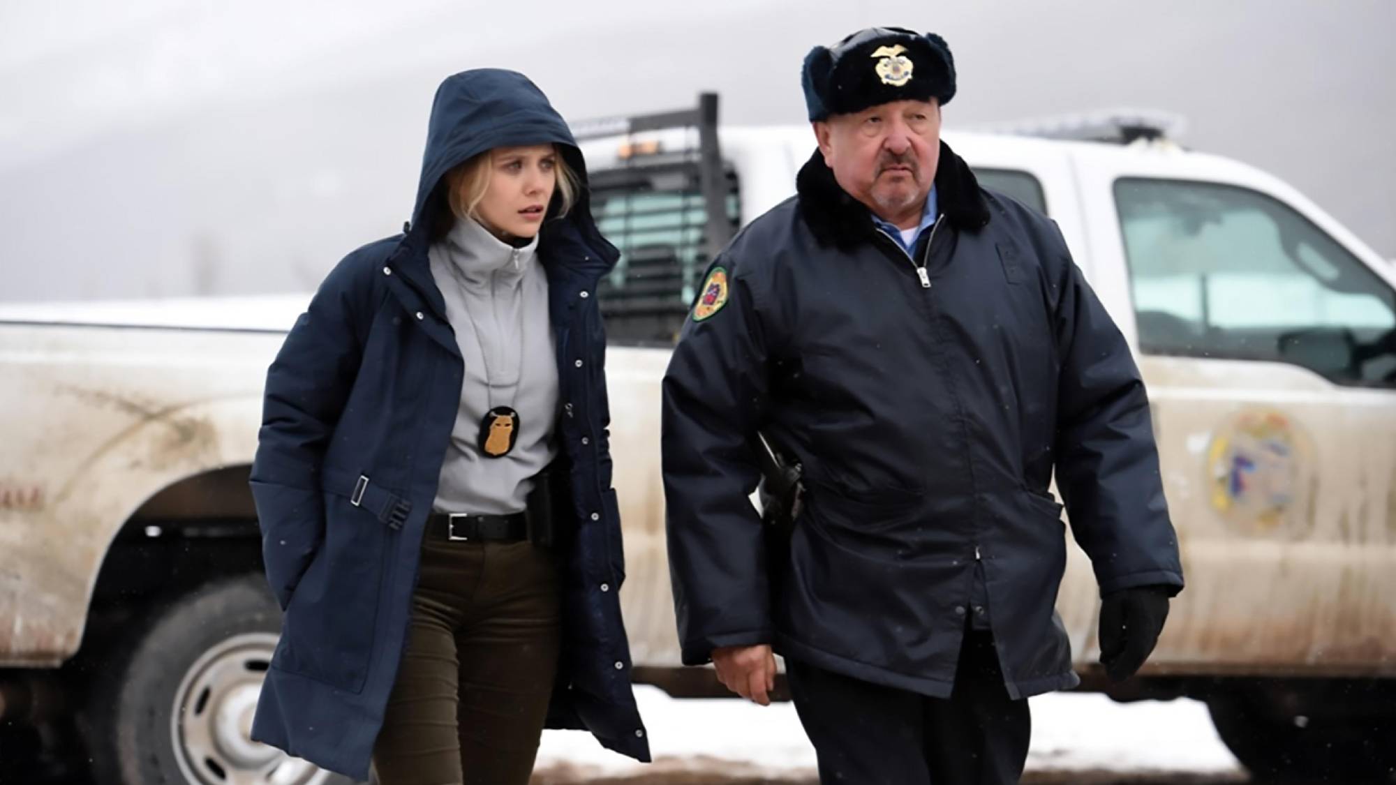 (L-R) Elizabeth Olsen as Agent Jane Banner and Graham Greene as Officer Ben Shoyo in &quot;Wind River&quot;