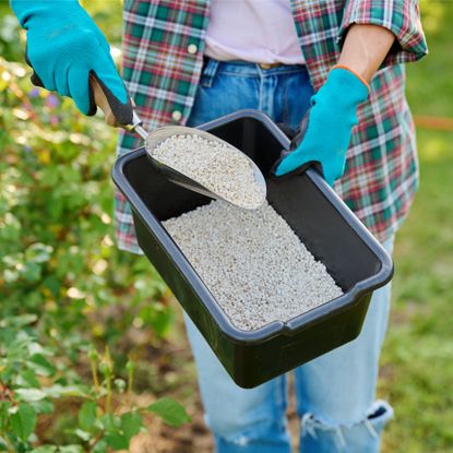 woman holding fertilizer