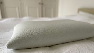 TheraPur® Memory Foam Ice Pillow on the bed