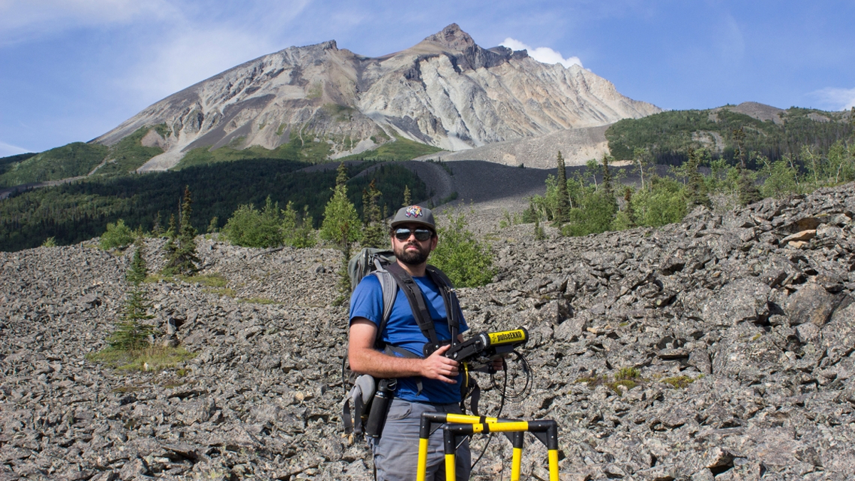 Tyler Meng, a doctoral student at the University of Arizona, surveys the Sourdough Rock Glacier in Alaska in 2021.
