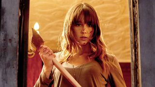 Sharni Vinson as Erin, holding an axe in &quot;You&#039;re Next&quot; (2011)