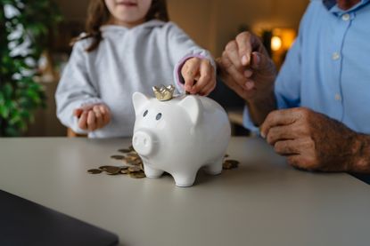Junior ISA (JISA) inheritance planning concept family with piggy bank